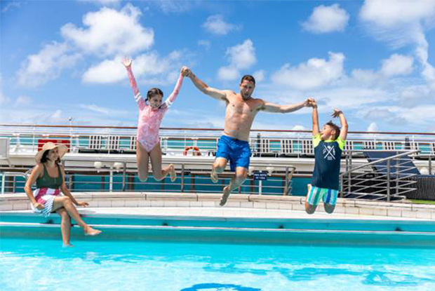 Family Jumping in Pool